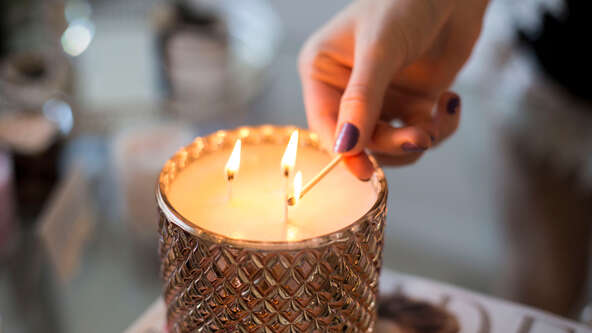 Learn about the significance of lighting a candle to honor someone who has passed away, including religious traditions and tributes to Veterans and first responders.